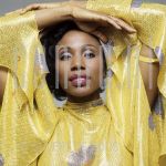 Syreeta (Date Unknown) at studio in Amsterdam.

[keywords]Posed, Headshot, Eyecontact, Smiling[/keywords]